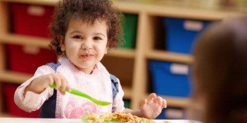 child eating USDA supplied food